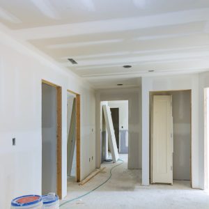 Construction building industry new home construction interior drywall tape and finish details installed door for a new home before installing